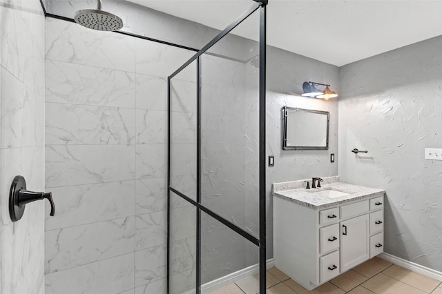 91 Pecan Dr, Pottsboro, TX 75076 - full bathroom featuring a tile shower, vanity, tile patterned floors, and baseboards
