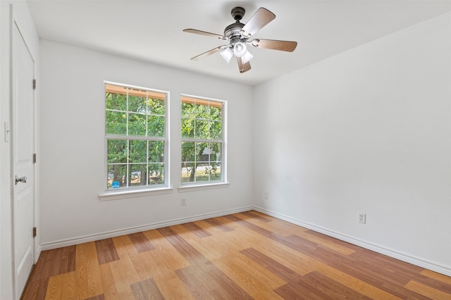 unfurnished room featuring light hardwood / wood-style flooring and ceiling fan