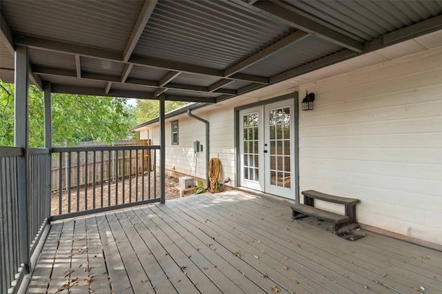 wooden deck featuring french doors