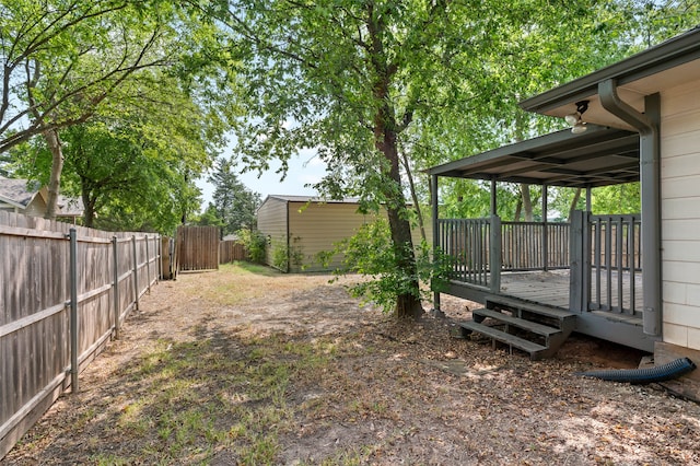 view of yard featuring a wooden deck