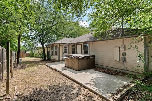 91 Pecan Dr, Pottsboro, TX 75076 - back of house featuring a hot tub, a patio, and a fenced backyard