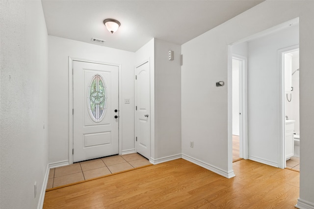 entrance foyer with light wood-type flooring