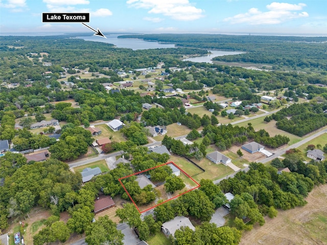 91 Pecan Dr, Pottsboro, TX 75076 - aerial overview of property's location featuring a nearby body of water, property parcel outlined, and a heavily wooded area