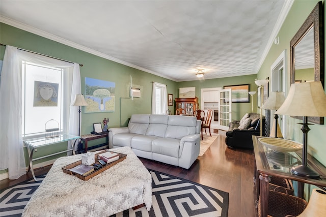 living room with crown molding, dark wood-type flooring, and plenty of natural light