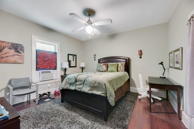 bedroom featuring cooling unit, ceiling fan, and dark hardwood / wood-style floors