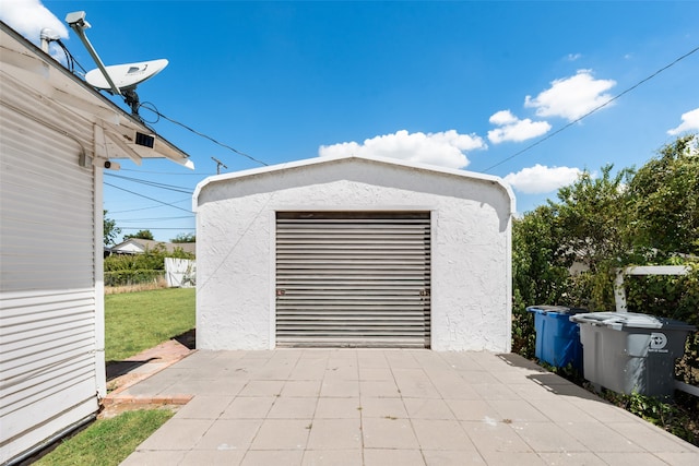 garage with a yard