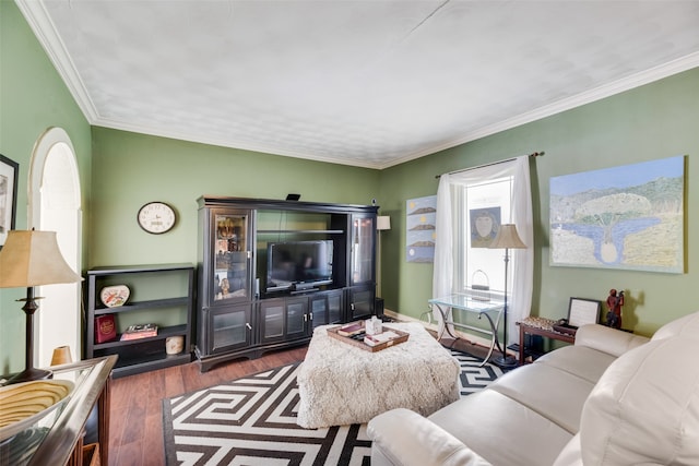 living room with dark hardwood / wood-style flooring and crown molding