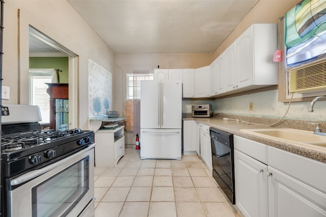 kitchen with dishwasher, stainless steel gas range oven, white cabinets, and white fridge