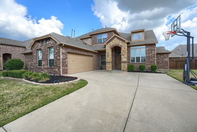 view of front facade featuring a front yard and a garage