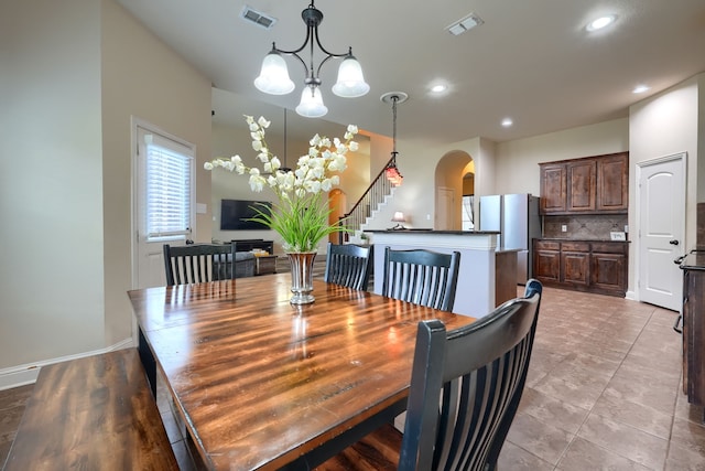 dining area featuring an inviting chandelier