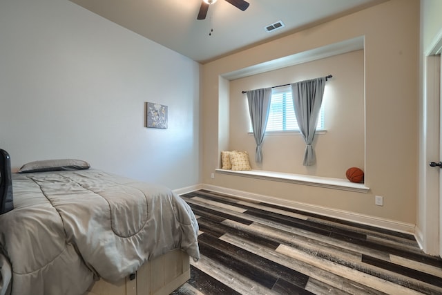 bedroom featuring ceiling fan and hardwood / wood-style flooring