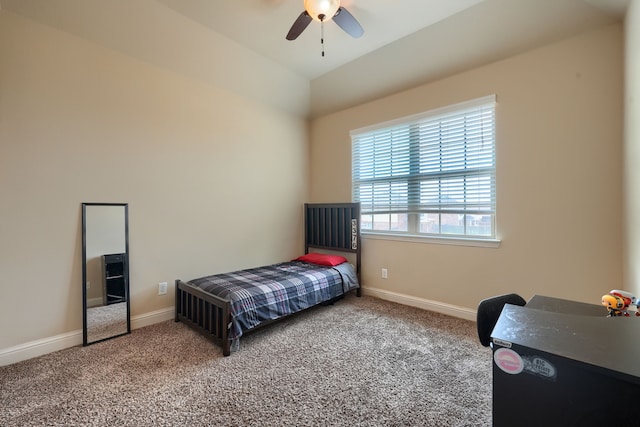 bedroom featuring lofted ceiling, carpet, and ceiling fan