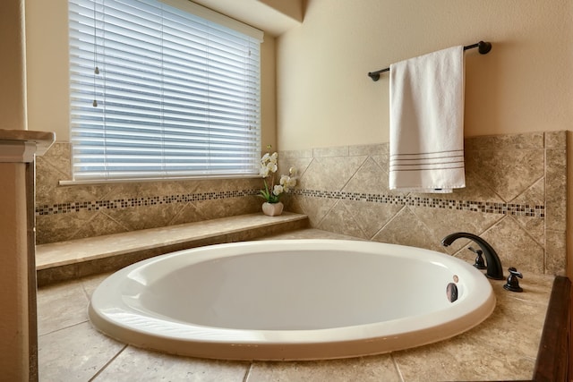 bathroom featuring tiled tub