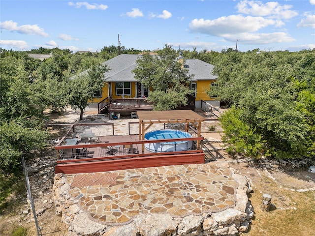 rear view of property with a patio area and a deck