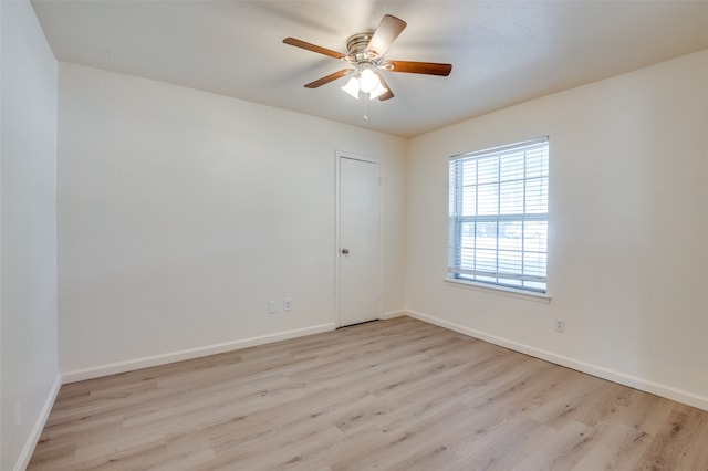 empty room featuring ceiling fan and light hardwood / wood-style flooring