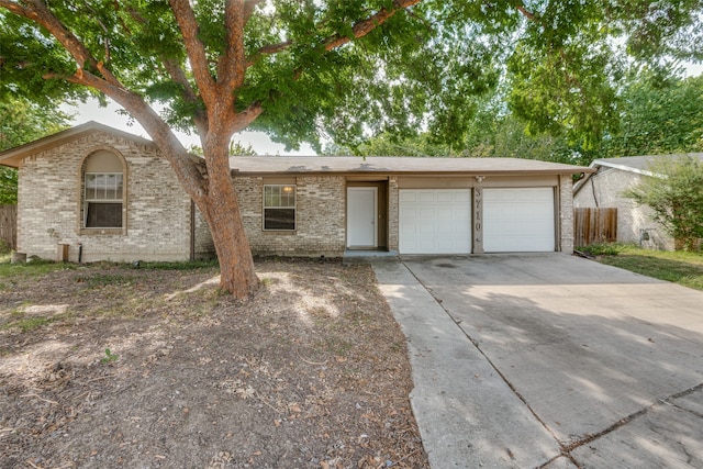 ranch-style home featuring a garage