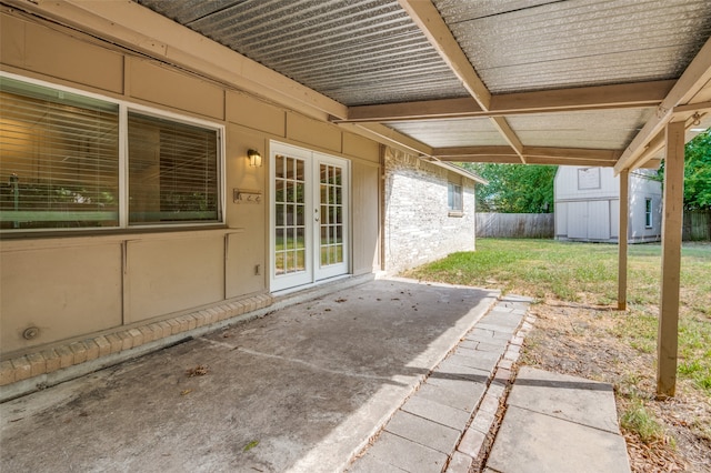 view of patio / terrace featuring a storage unit