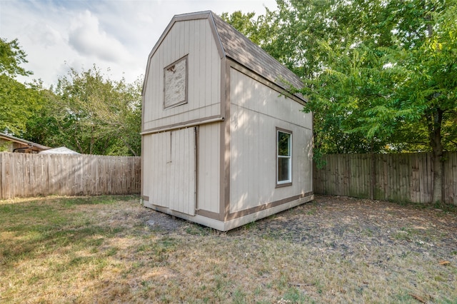 view of outbuilding featuring a lawn