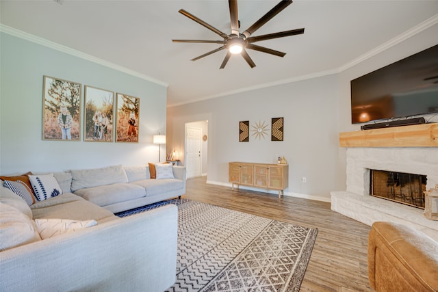 living room featuring crown molding, ceiling fan, and hardwood / wood-style flooring