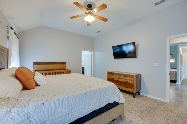 carpeted bedroom featuring lofted ceiling and ceiling fan