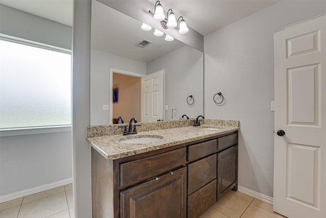 bathroom with vanity and tile patterned flooring