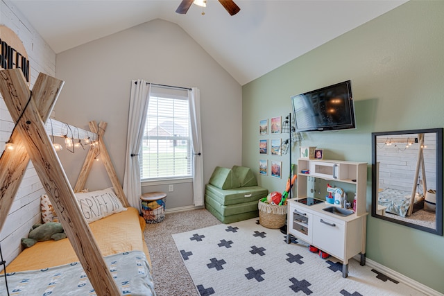 recreation room featuring light colored carpet, ceiling fan, and lofted ceiling