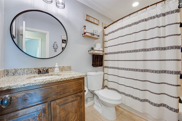 bathroom featuring vanity, toilet, curtained shower, and tile patterned floors