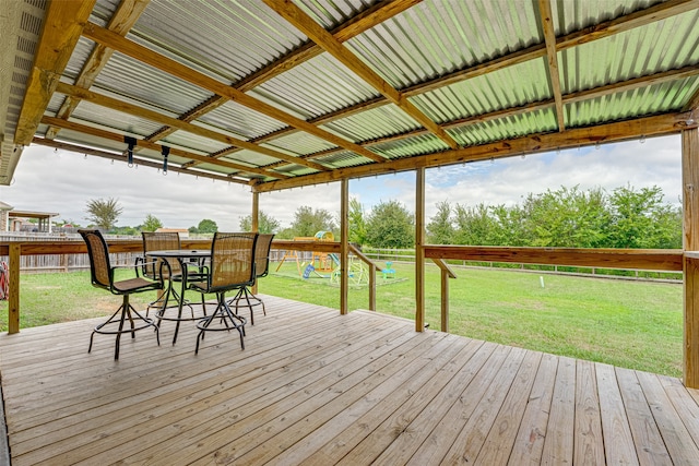 wooden deck with a lawn