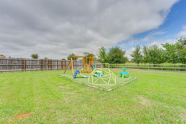 view of playground with a yard