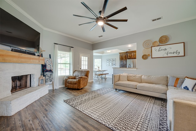 living room featuring ornamental molding, dark hardwood / wood-style flooring, and ceiling fan