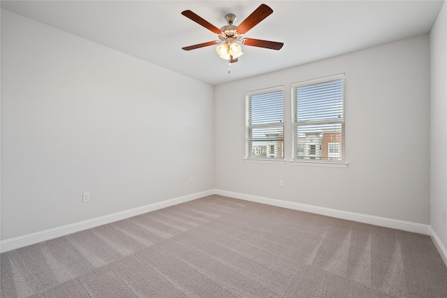 empty room featuring carpet flooring and ceiling fan