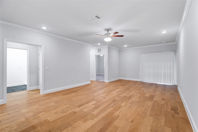 empty room featuring light hardwood / wood-style flooring, ornamental molding, and ceiling fan