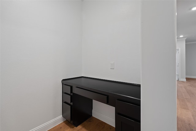 interior details featuring hardwood / wood-style flooring and ornamental molding