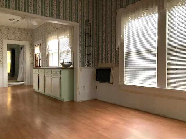 unfurnished living room featuring light wood-type flooring