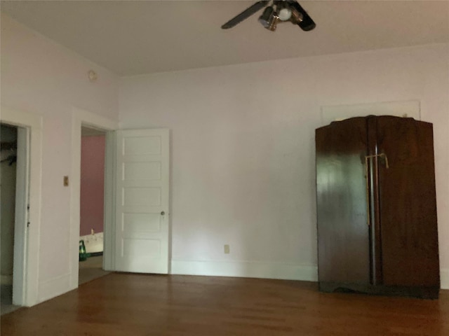 unfurnished room with hardwood / wood-style floors and ceiling fan