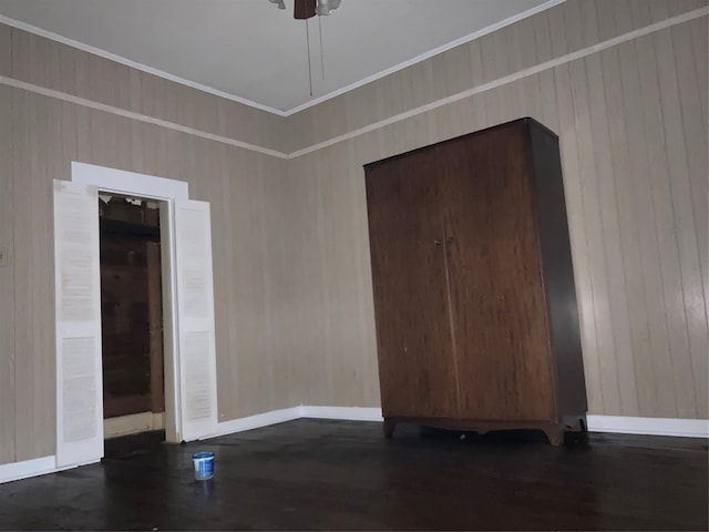 spare room featuring hardwood / wood-style floors and ceiling fan