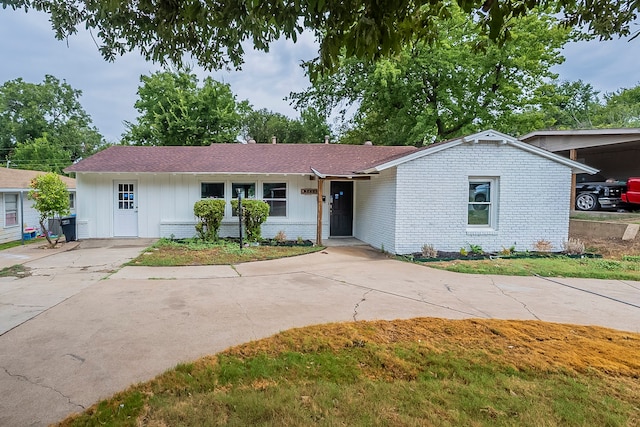 single story home featuring a carport