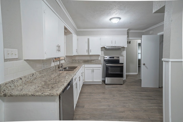 kitchen featuring backsplash, appliances with stainless steel finishes, white cabinetry, dark hardwood / wood-style floors, and a textured ceiling