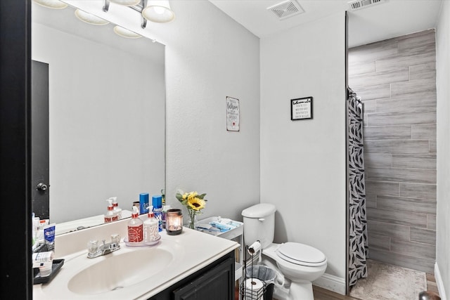 bathroom with vanity, a shower with curtain, wood-type flooring, and toilet