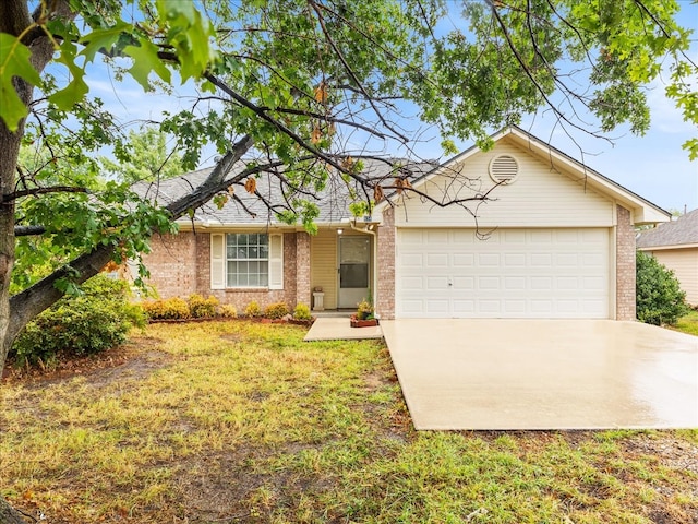 ranch-style house with a garage and a front lawn