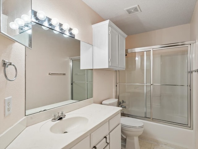 full bathroom with shower / bath combination with glass door, toilet, a textured ceiling, and vanity