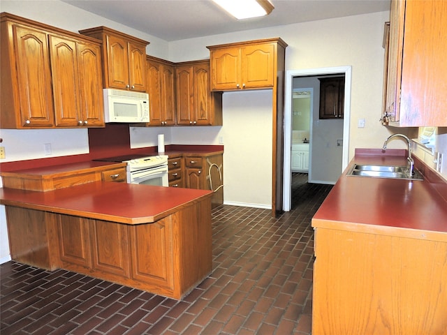 kitchen featuring white appliances and sink