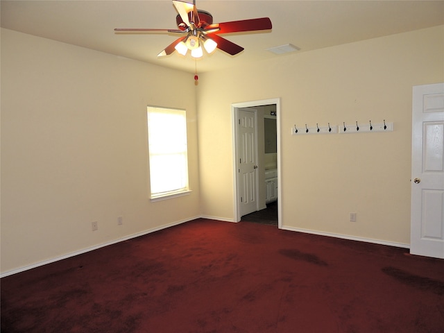 interior space with ceiling fan