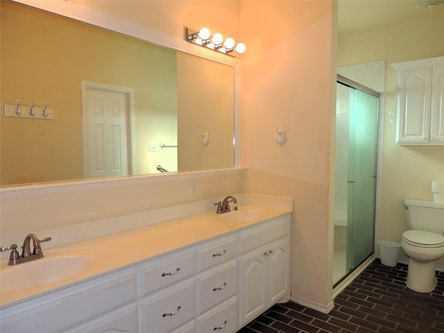 bathroom with vanity, toilet, and an enclosed shower