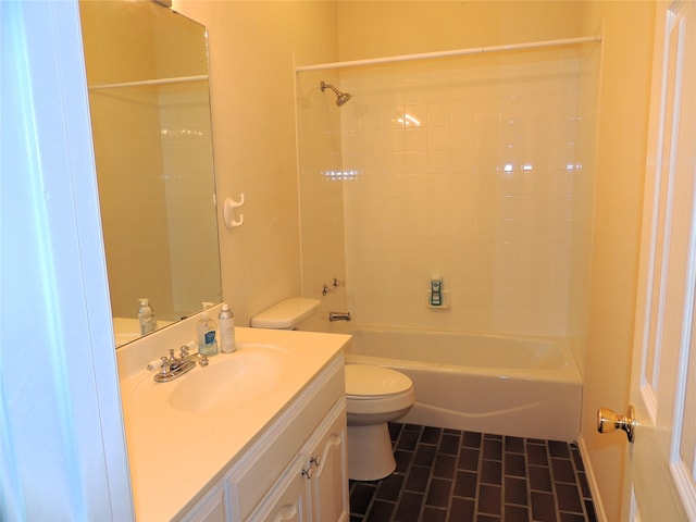 full bathroom featuring vanity, toilet, and tiled shower / bath combo