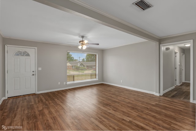 unfurnished room with ornamental molding, dark wood-type flooring, and ceiling fan