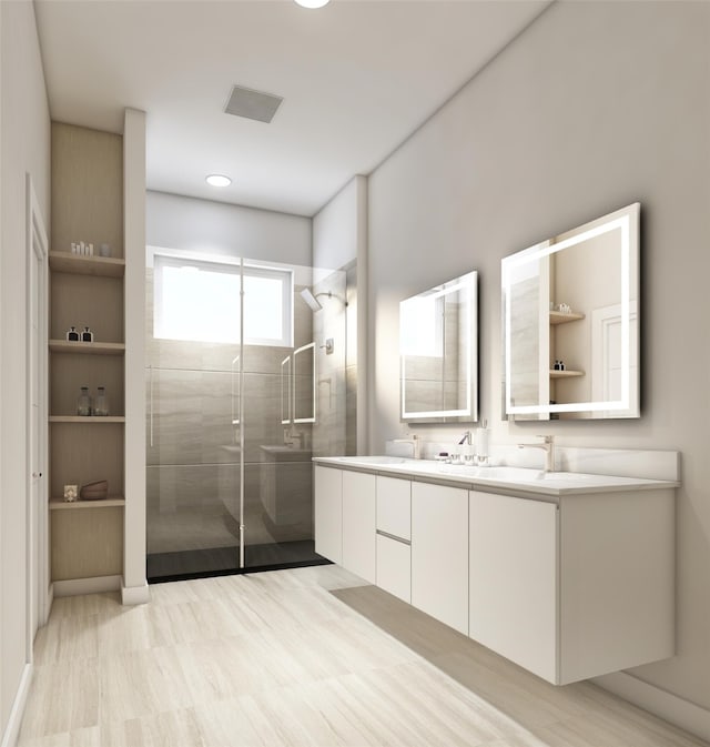 bathroom with vanity and a shower with shower door