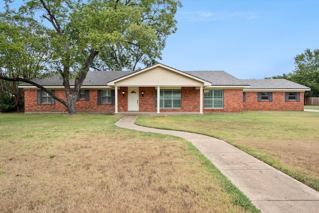 single story home featuring a front lawn and covered porch