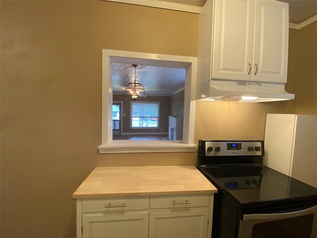 kitchen featuring electric stove, ornamental molding, light countertops, under cabinet range hood, and white cabinetry