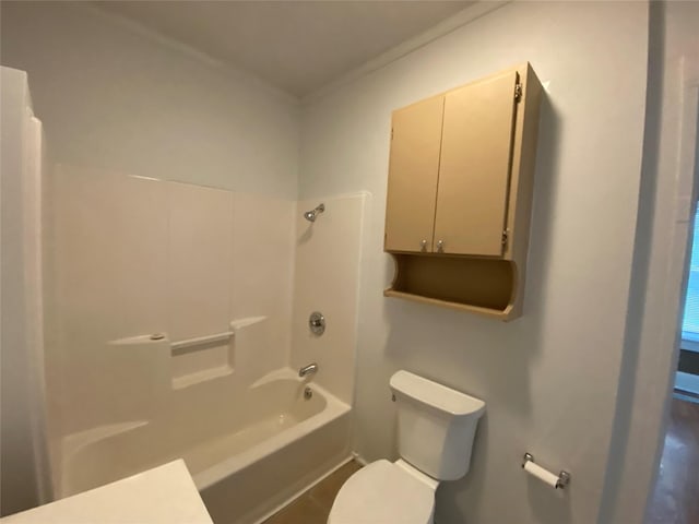 bathroom with bathtub / shower combination and toilet